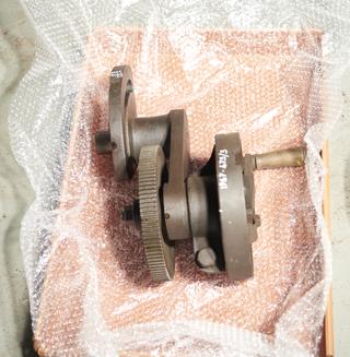 Bracket carrying latch plate and spur wheel