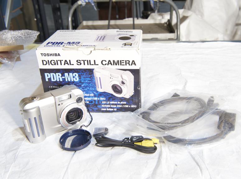 Toshiba PDR-M3 digital camera with original packaging.