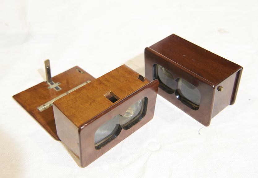 Two folding hand stereoscopes.