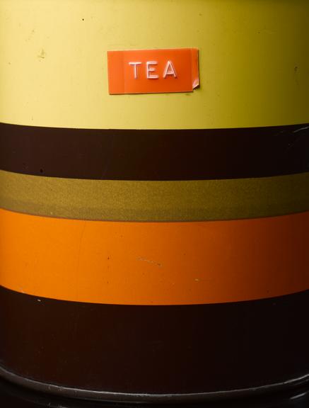 Orange, yellow and brown striped container for tea, English