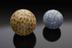 Pair of carpet bowls,one of earthenware