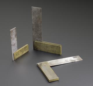 Three small steel set-squares, with brass stocks