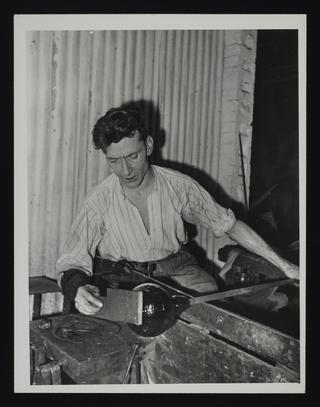 A photographic print of Industry, Glass, Blowing