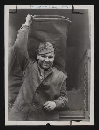 Daily Herald Photograph: Soldier delivers emergency coal
