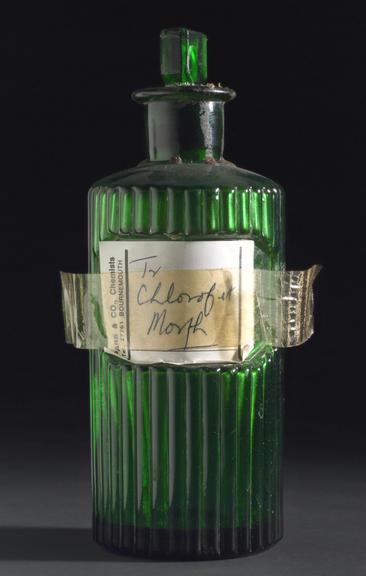 Ribbed green glass poison bottle with glass stopper of Tincture of Morphine and Chloroform