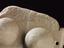 Pair of votive breasts, marble, on inscribed slab, Greek