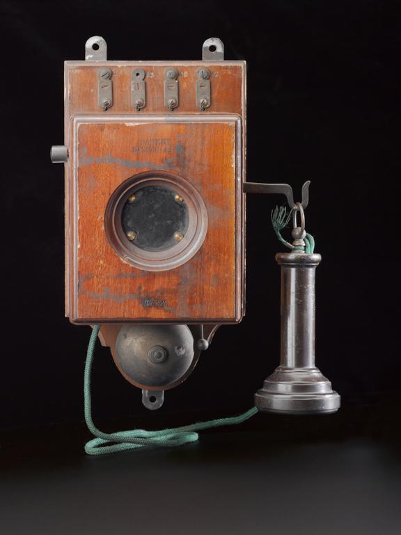 Wall telephone with mica-diaphragm transmitter and built-in