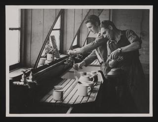 A photographic print of Housing, Post War, Early Post War Difficulties, Squatters - Service Huts Seized By Homeless