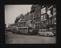 A London street scene with buses and cars