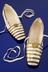 Pair of Queen Victoria's white satin slippers with bars of gold