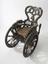 Carved wooden wheelchair, Europe, 1850-1890 (invalid chair)