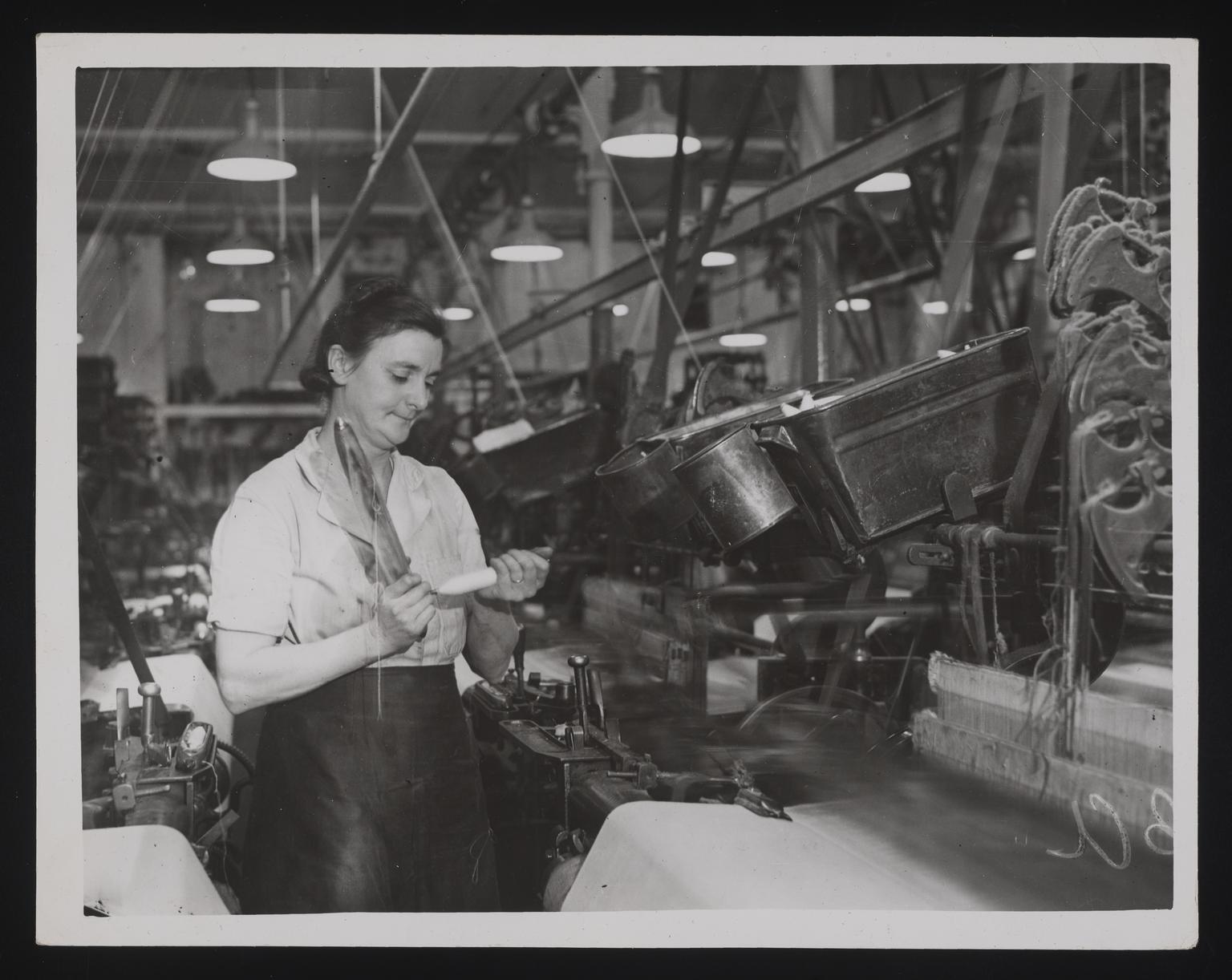 A photographic print of Industry, Textiles - Cotton, Shuttling ...