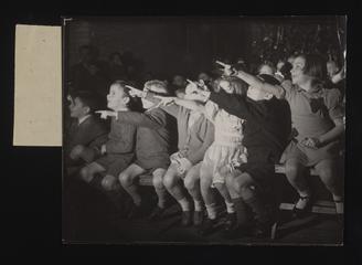 An audience of children at a Punch and Judy show