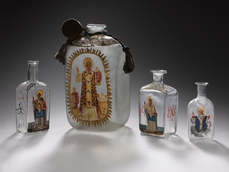 Glass bottle with Saint