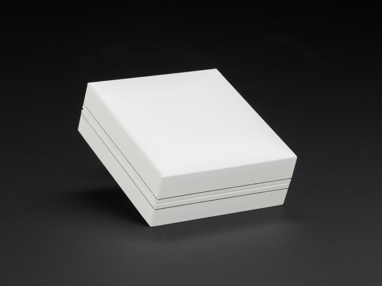 White jewellery box for small piece of wood inscribed "Never Give Up Hope"