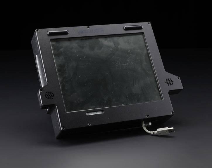 Computer, monitor and speaker unit in black enclosure. Includes Intel Centrino label