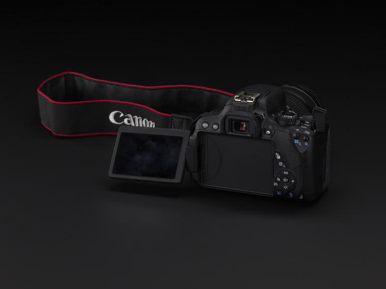 Canon EOS 650D camera with fabric strap. Made in Japan