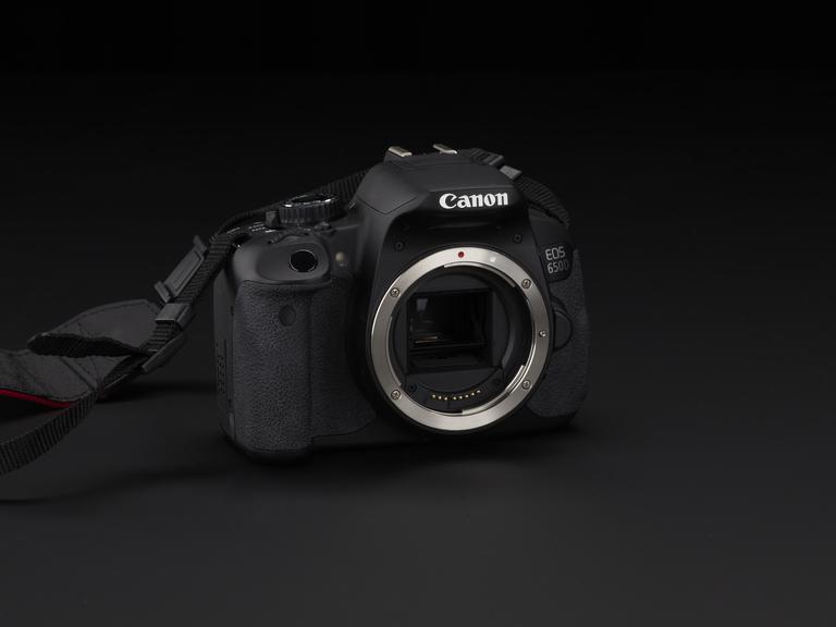 Canon EOS 650D camera with fabric strap. Made in Japan