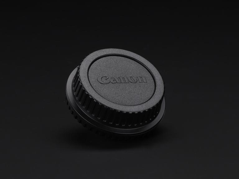 Two lens caps slotted together