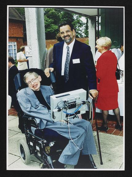 Framed photograph of Stephen Hawking with philanthropist Dennis Avery (color photograph; frame)