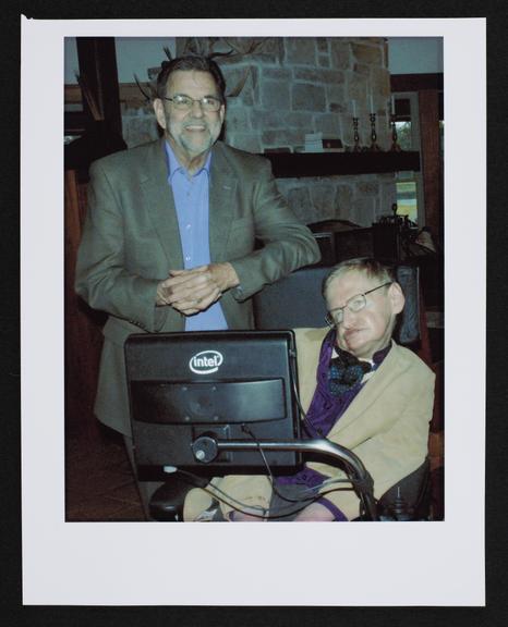 Framed photograph of Stephen Hawking with philanthropist Dennis Avery