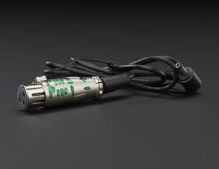 Black cable with metal connector labelled �Pin 3 +�