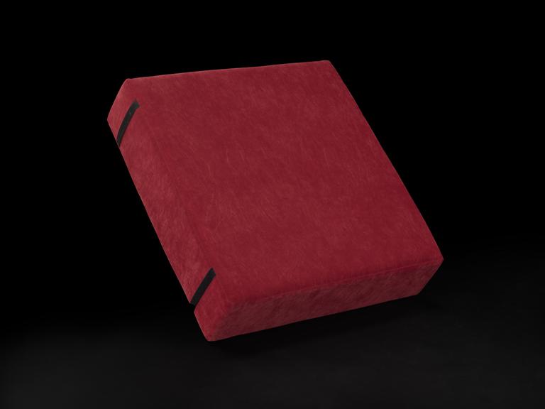 Red square cushion with two strips of Velcro on the back