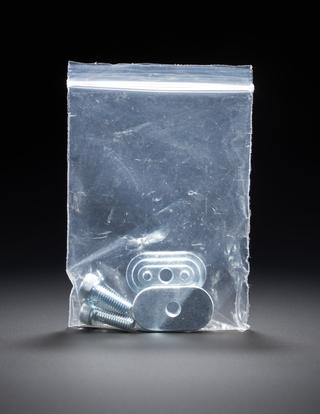 Plastic bag containing two screws and two wide washers