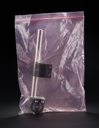 Metal bar with attached brackets