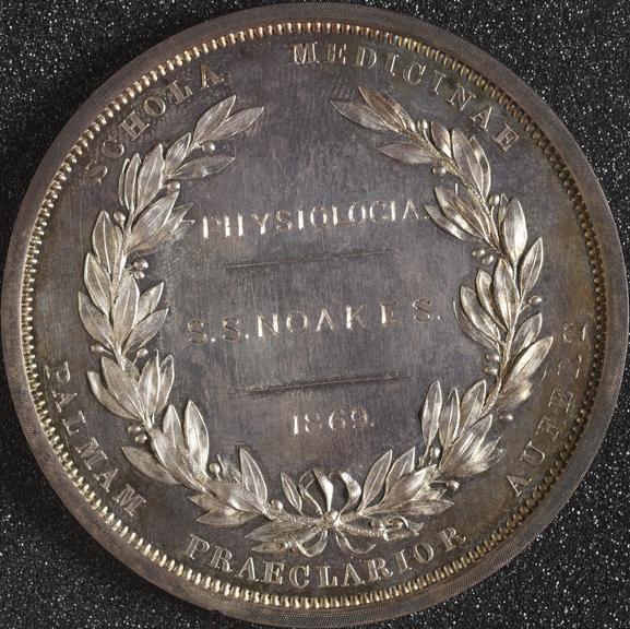 Circular silver plated prize medal