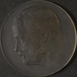 One of four glass medals