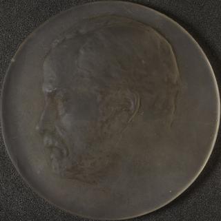 One of four glass medals