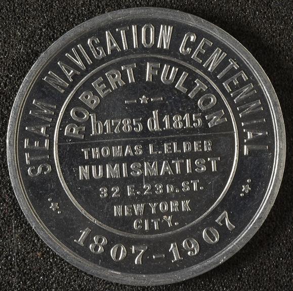 Circular white metal medal