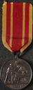 Silver prize medal with red and yellow ribbon