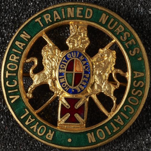 Circular gilt and enamel badge