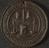Circular brass(?) medal with suspension hole, comm