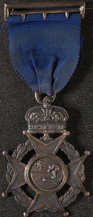 Silver prize medal with ribbon and claw brooch