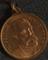 Circular copper medal with loop commemorates Prof. R. Koch