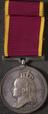 Silver medal with long silk ribbon