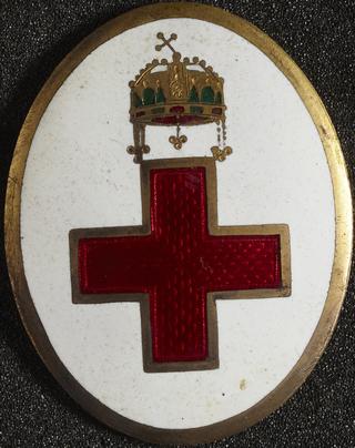 Gilt and enamelled lapel badge