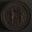 Circular wooden proof medal with scenes describing virtue of