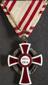 Enamelled cross shaped medal with ribbon