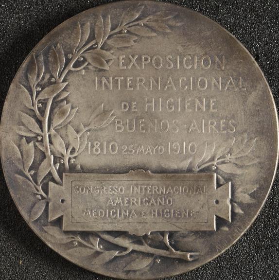 Circular silver-plated bronze medal