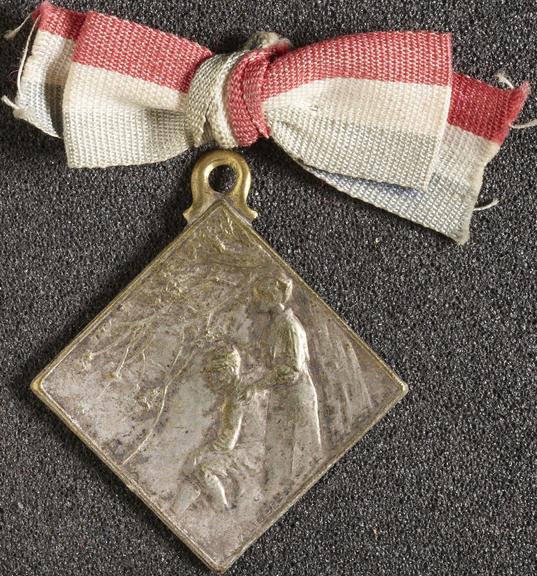 Medal, square, attached to red