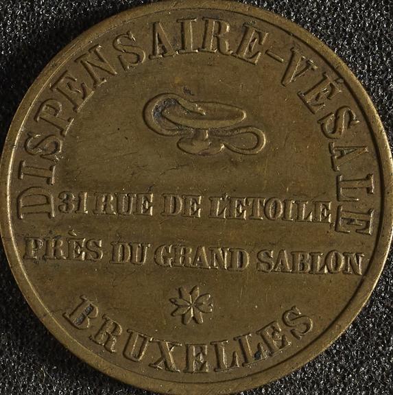 Brass trade token advertising the Dispensaire-Vesale in Brussels