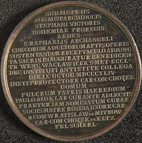 Silver medal commemorating building renovated and extended by