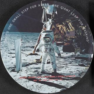 Plate commemorating the Apollo Moon landing and famous quote