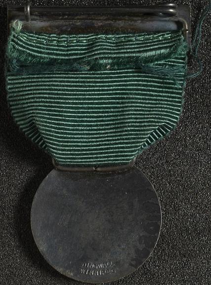 Silver and enamel membership badge
