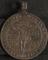 Silver religious medallion