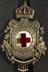 Elaborate enamelled and filigree Red Cross brooch